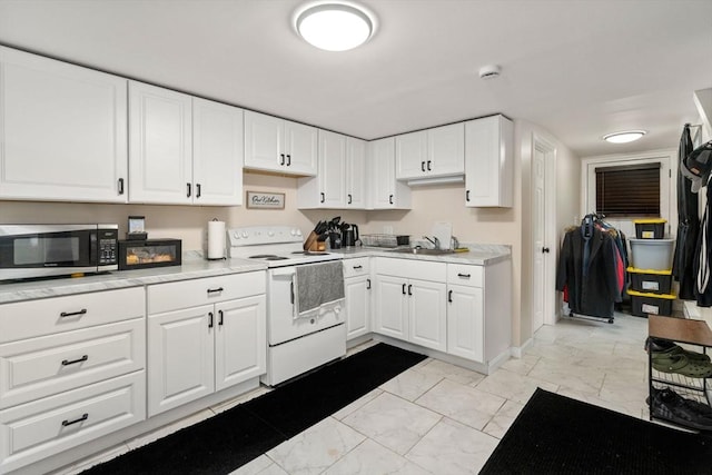 kitchen featuring white electric range oven, a sink, stainless steel microwave, light countertops, and marble finish floor