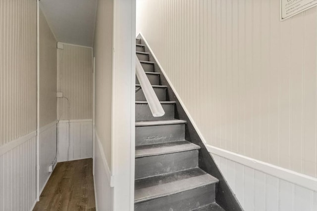 stairway with wood finished floors
