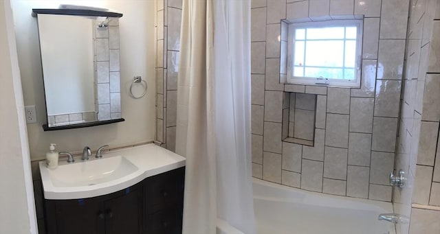 bathroom with shower / bath combo and vanity