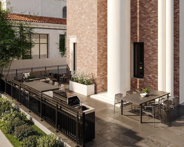 61 Hall St Unit 3, Waltham, MA 02453 - view of patio / terrace featuring outdoor dining space and an outdoor kitchen