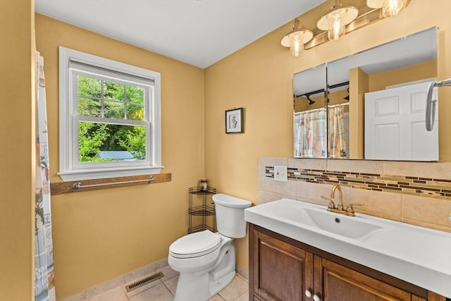 31 Fearing Hill Rd, Wareham, MA 02571 - bathroom featuring vanity, toilet, tile patterned flooring, baseboards, and tasteful backsplash