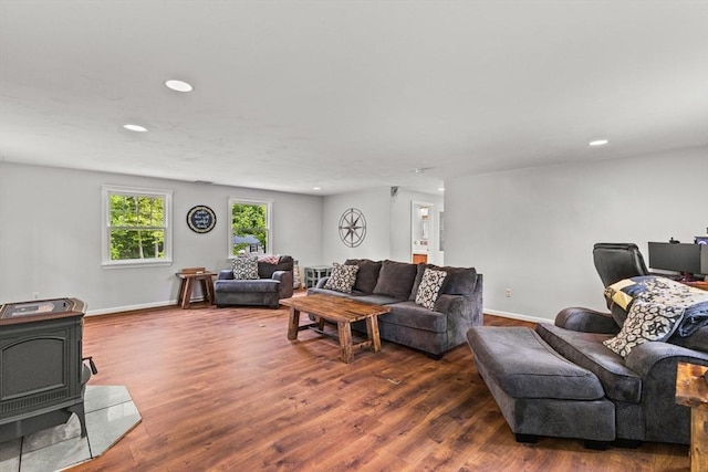 31 Fearing Hill Rd, Wareham, MA 02571 - living area with a wood stove, recessed lighting, dark wood-style flooring, and baseboards