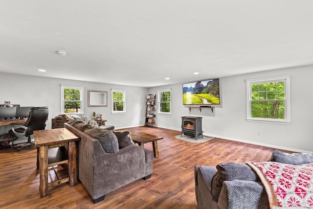 31 Fearing Hill Rd, Wareham, MA 02571 - living area featuring a wood stove, recessed lighting, plenty of natural light, an office area, and wood finished floors