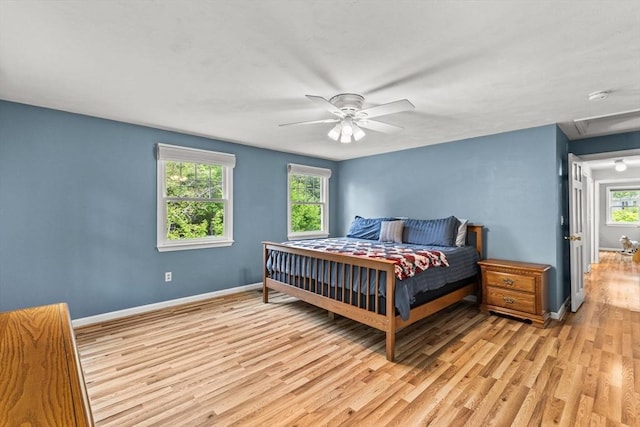 31 Fearing Hill Rd, Wareham, MA 02571 - bedroom with light wood-style flooring, multiple windows, baseboards, and a ceiling fan