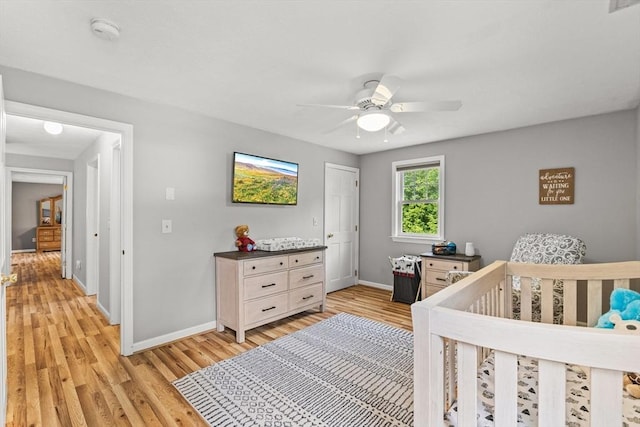 31 Fearing Hill Rd, Wareham, MA 02571 - bedroom with baseboards, light wood finished floors, a ceiling fan, and a nursery area