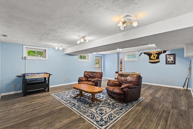 31 Fearing Hill Rd, Wareham, MA 02571 - living area with wood finished floors, baseboards, plenty of natural light, and a textured ceiling