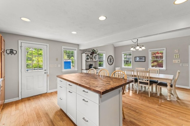 31 Fearing Hill Rd, Wareham, MA 02571 - kitchen with wood counters, light wood-type flooring, baseboards, recessed lighting, and white cabinetry