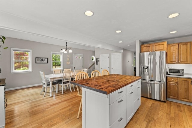 31 Fearing Hill Rd, Wareham, MA 02571 - kitchen featuring stainless steel appliances, light wood-style flooring, a kitchen breakfast bar, recessed lighting, and wood counters
