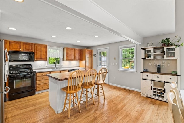 31 Fearing Hill Rd, Wareham, MA 02571 - kitchen with black appliances, light wood-type flooring, baseboards, a sink, and recessed lighting