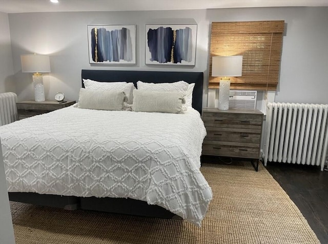 bedroom featuring radiator and dark wood-type flooring