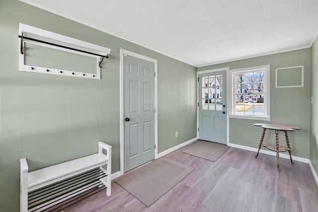 mudroom with wood finished floors and baseboards