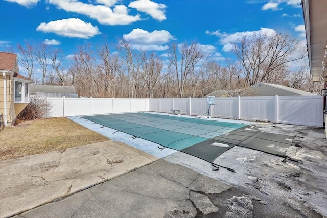 view of pool featuring a patio area, fence, and a fenced in pool