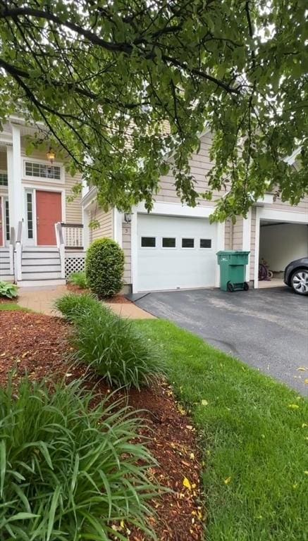5 Lincoln Ln Unit 5, Grafton, MA 01536 - view of front facade featuring a garage and asphalt driveway