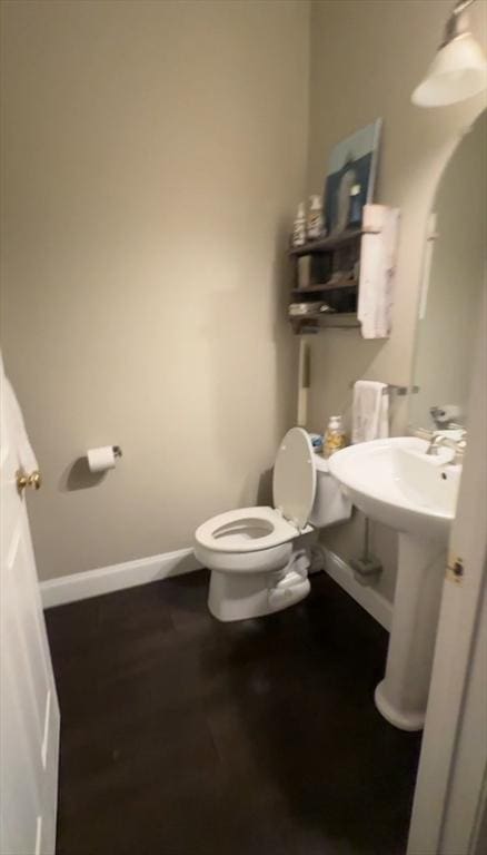 5 Lincoln Ln Unit 5, Grafton, MA 01536 - half bathroom featuring toilet, baseboards, and wood finished floors