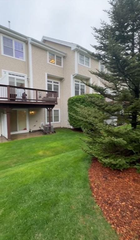 5 Lincoln Ln Unit 5, Grafton, MA 01536 - rear view of house with a yard and a deck