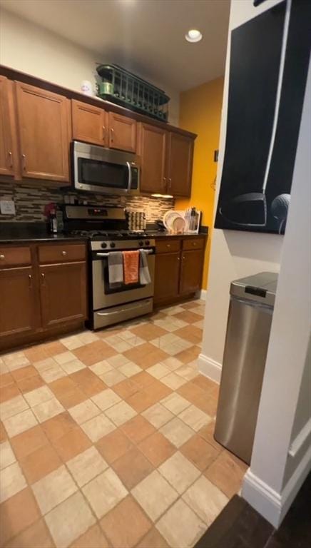 5 Lincoln Ln Unit 5, Grafton, MA 01536 - kitchen featuring stainless steel appliances, decorative backsplash, dark countertops, baseboards, and recessed lighting