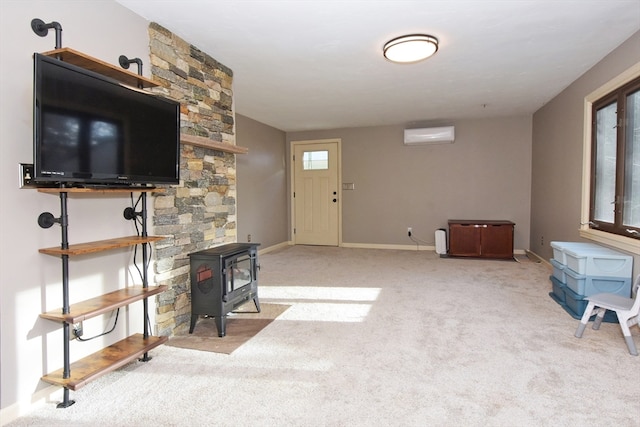 carpeted living room featuring a wall unit AC and plenty of natural light