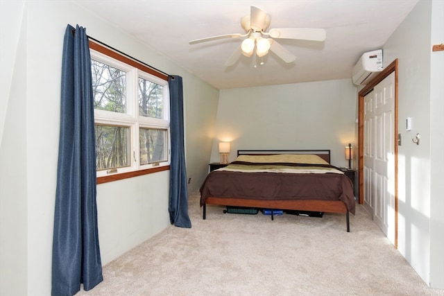 bedroom featuring a wall unit AC, ceiling fan, and light carpet