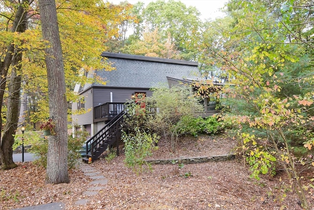 back of house with a wooden deck