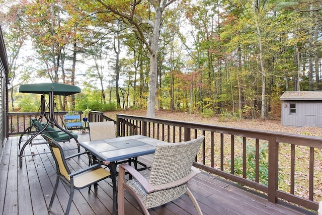 wooden terrace with an outdoor structure