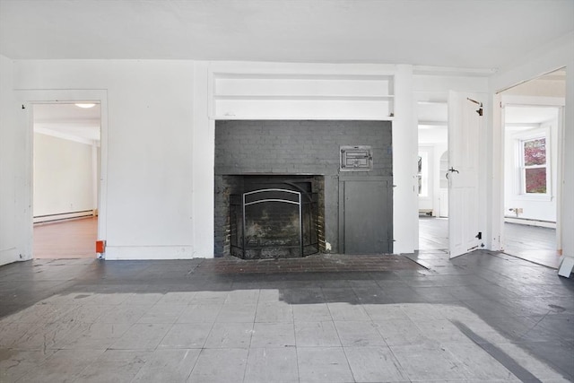 unfurnished living room featuring baseboard heating and a fireplace