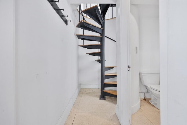 stairway with baseboards