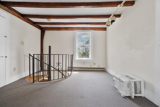 carpeted empty room featuring baseboards, a baseboard radiator, beam ceiling, and an AC wall unit
