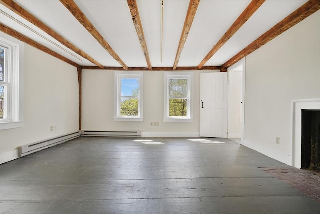 unfurnished living room featuring a baseboard heating unit and hardwood / wood-style flooring