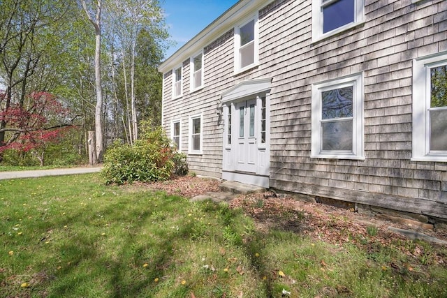 view of home's exterior featuring a yard
