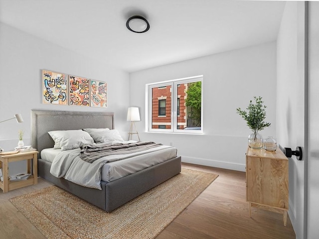 27 Dixwell Unit 11, Boston, MA 02119 - bedroom with wood finished floors and baseboards