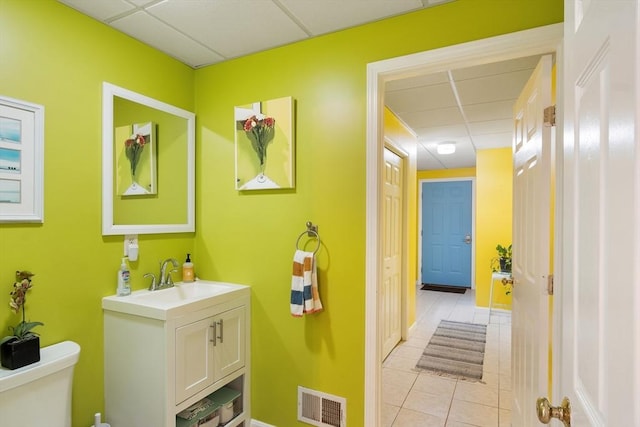4 Fiske Ave, Chelmsford, MA 01863 - bathroom with a drop ceiling, vanity, and tile patterned floors