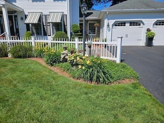 view of yard with a garage