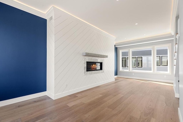 308 Newton St, Waltham, MA 02453 - unfurnished living room featuring baseboards, crown molding, wood finished floors, a glass covered fireplace, and recessed lighting