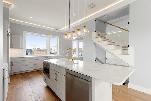 308 Newton St, Waltham, MA 02453 - kitchen with appliances with stainless steel finishes, a sink, light wood-style flooring, modern cabinets, and recessed lighting