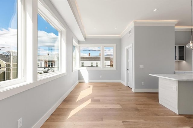 308 Newton St, Waltham, MA 02453 - corridor featuring crown molding, baseboards, and light wood-style floors
