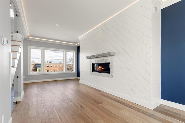 308 Newton St, Waltham, MA 02453 - unfurnished living room featuring wood finished floors, a fireplace, ornamental molding, baseboards, and recessed lighting