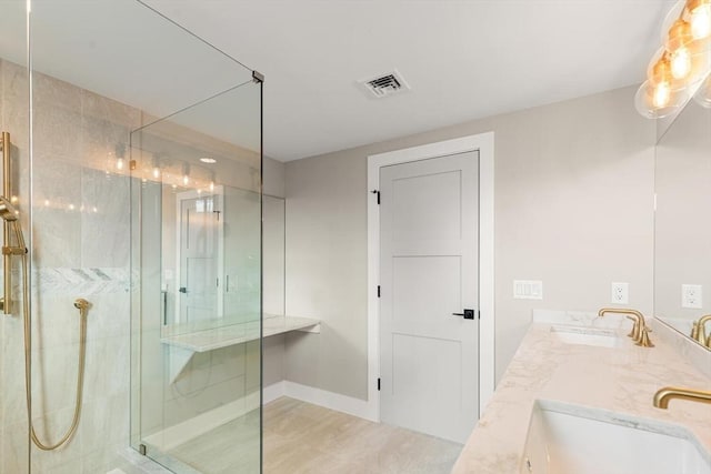 308 Newton St, Waltham, MA 02453 - bathroom with walk in shower, double vanity, and baseboards