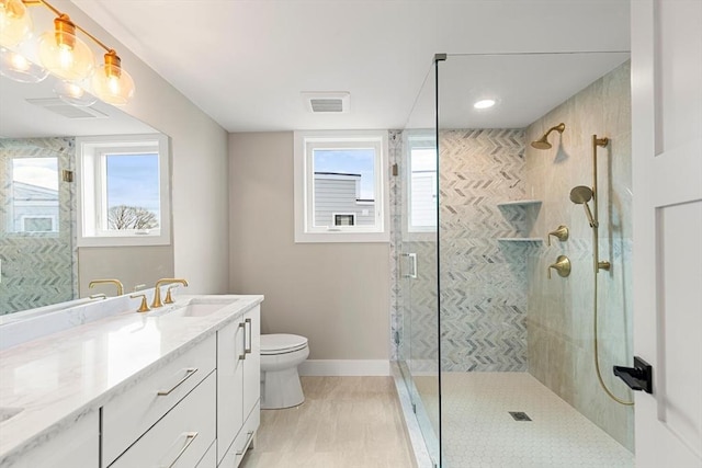 308 Newton St, Waltham, MA 02453 - bathroom featuring toilet, plenty of natural light, a stall shower, and vanity