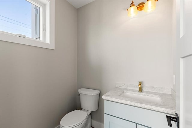 308 Newton St, Waltham, MA 02453 - bathroom featuring vanity, toilet, and baseboards