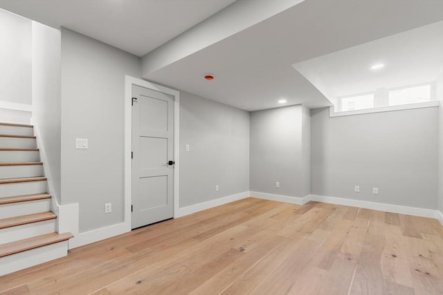308 Newton St, Waltham, MA 02453 - basement featuring light wood-style floors, stairway, baseboards, and recessed lighting