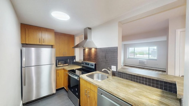 kitchen with a baseboard heating unit, a sink, ventilation hood, decorative backsplash, and stainless steel appliances