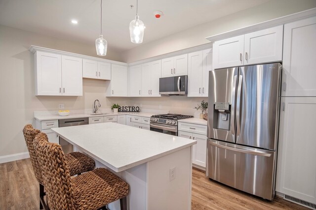 kitchen featuring white cabinets, sink, and stainless steel appliances