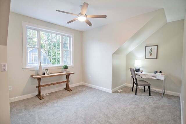 carpeted home office featuring ceiling fan and lofted ceiling