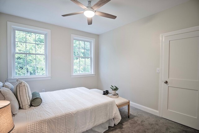 carpeted bedroom featuring ceiling fan