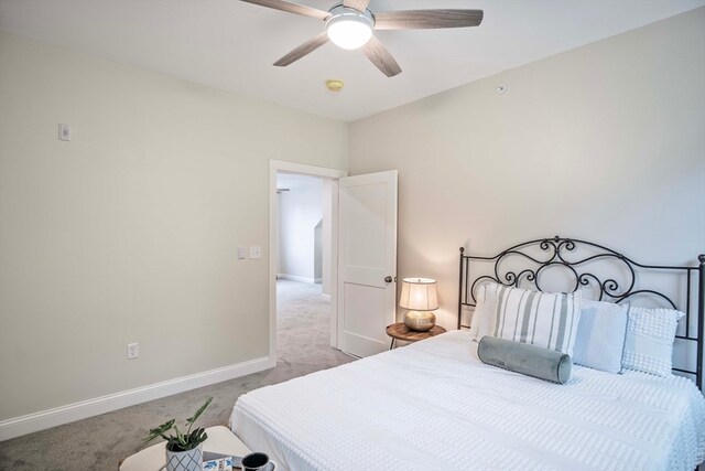 bedroom with ceiling fan and light carpet