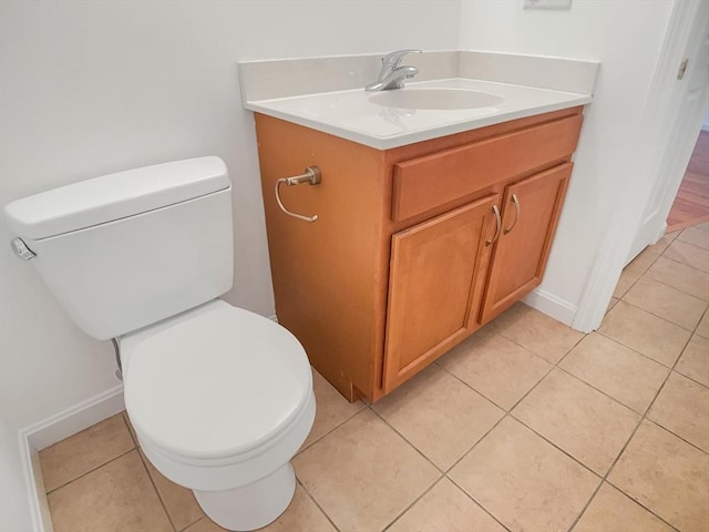 bathroom with vanity, toilet, and tile patterned flooring