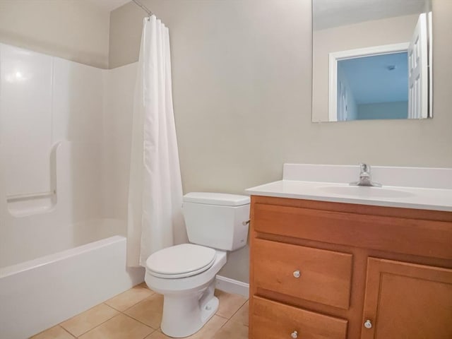 bathroom featuring tile patterned floors, toilet, vanity, and shower / bath combo