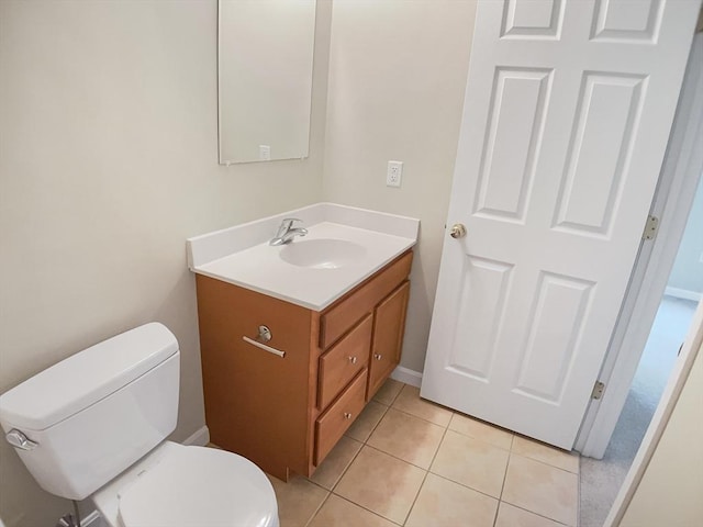 bathroom featuring vanity, toilet, and tile patterned floors
