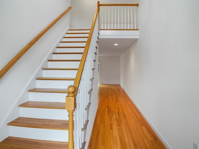 stairs with wood finished floors