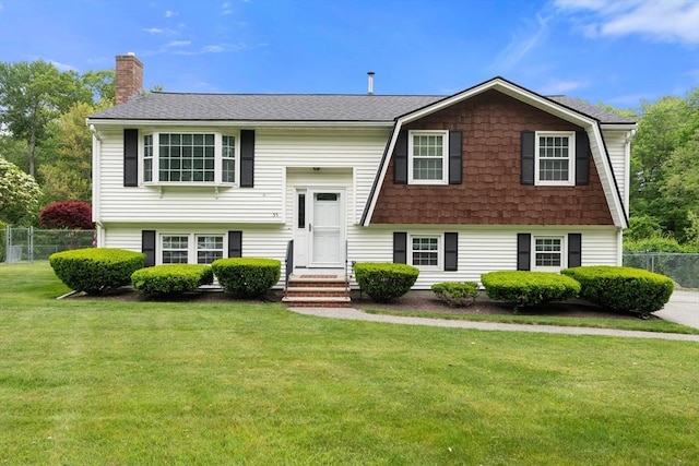55 Glen Rd, Wilmington, MA 01887 - bi-level home with a chimney and roof with shingles